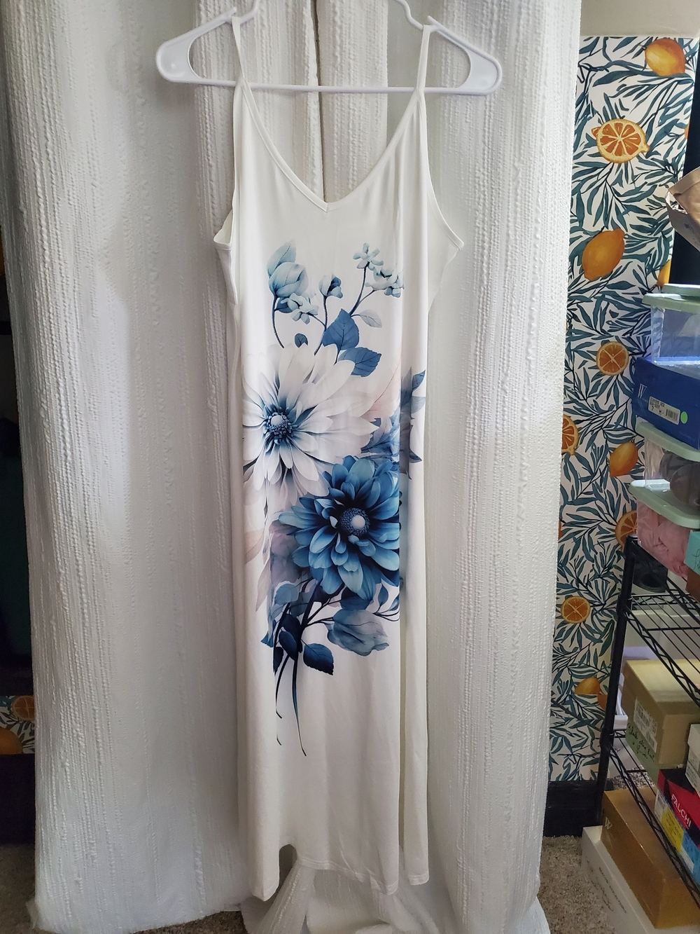 Sleeveless White Maxi Dress with Blue Floral Print